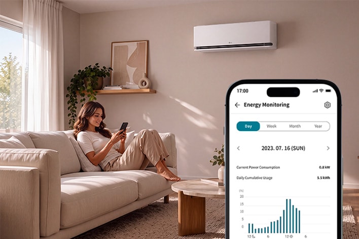Woman using Energy Monitoring on her smartphone under an LG DUALCOOL AI Air