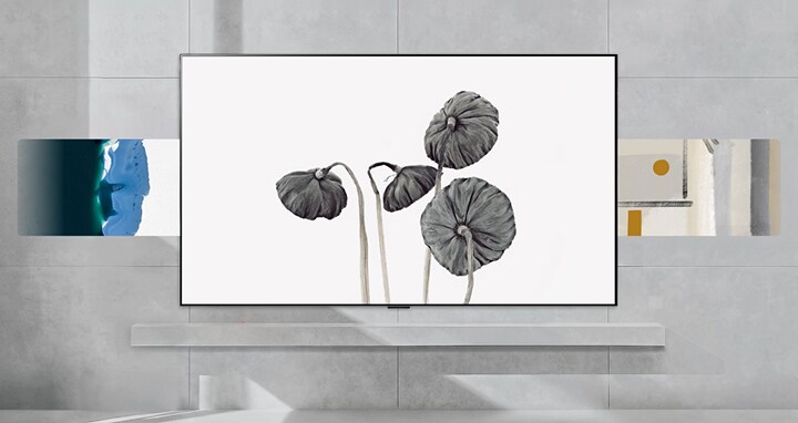 LG Gallery+ showcases curated artwork in a modern home interior, featuring stylized gray botanical prints at the center,