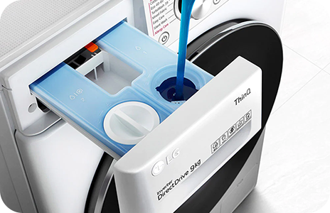 This is an image of putting detergent into the washing machine.