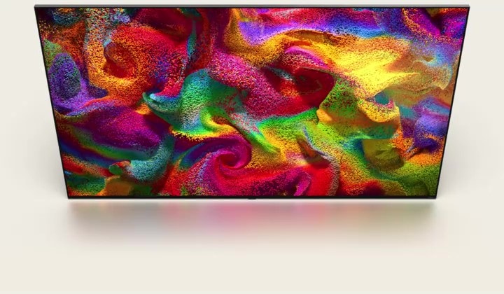 Veelkleurig zand explodeert in alle richtingen, een wervelend patroon vormend, en verandert vervolgens in het scherm van een LG TV.
