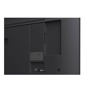 LG TV with an impressively large screen mounted on a wall above a LG Soundbar in a modern style living room.