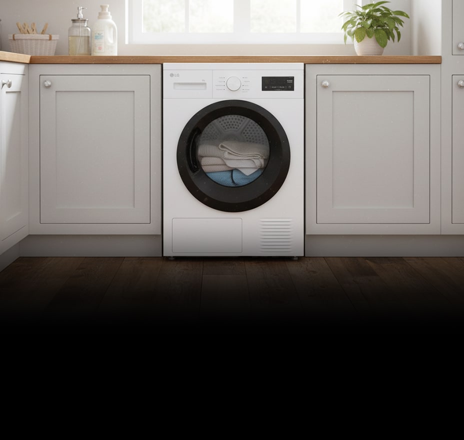 A white front-loading dryer is built into cabinetry, with folded towels visible inside the drum.