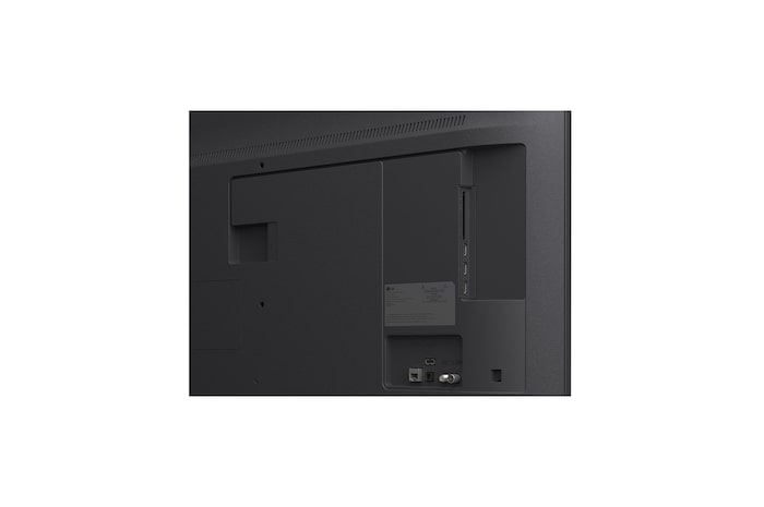 LG TV with an impressively large screen mounted on a wall above a LG Soundbar in a modern style living room.