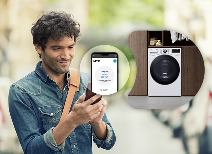 A man remotely controlling the LG dryer through a ThinQ app