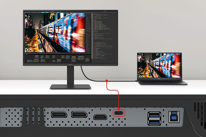 Een afbeelding van een laptop en monitor verbonden met één USB-C-kabel.
