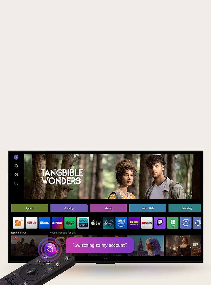 On an LG TV screen is the webOS 25 home page filled with apps and entertainment content. By the TV is the LG AI Magic Remote, the AI button is highlighted as if activated by the user's voice. A speech bubble is beside it, switching to my account. 
