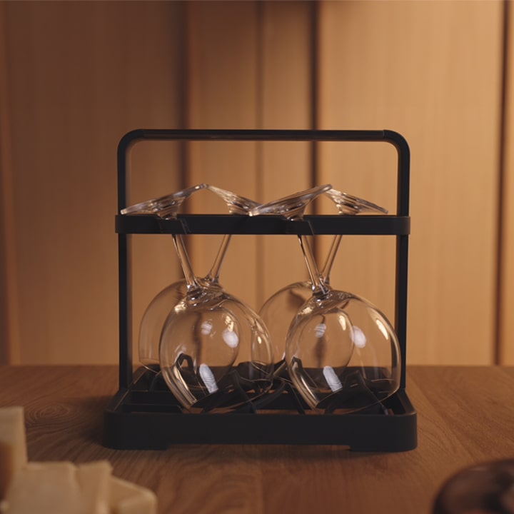 Wine glasses being loaded onto the Wine Glass Rack and placed in an LG Dishwasher for a wash cycle.