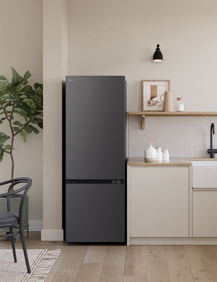 Overall view of the kitchen with lg bottom freezer refrigerator installed beside the countertop.	