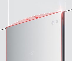 The top of the freezer is shown at an angle with two arrows pointing in toward the wall to indicate it is flush with the cabinets surrounding it.