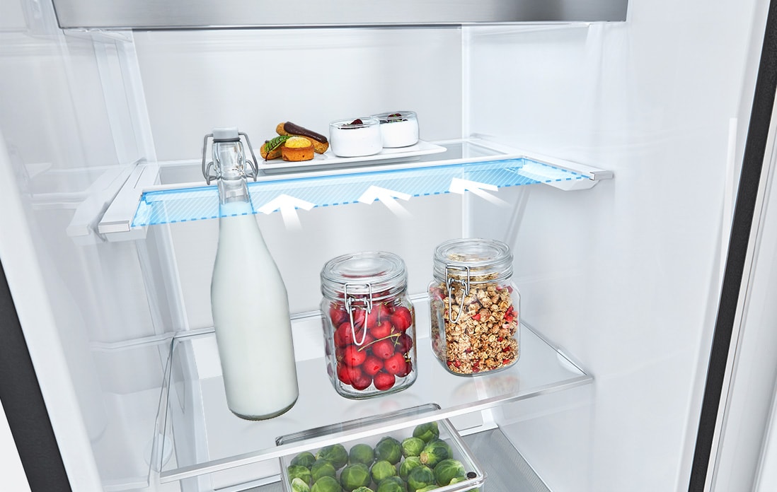 The front of a freezer is shown with blue shape and arrows pointing to demonstrate how the freezer fits in a kitchen space. 