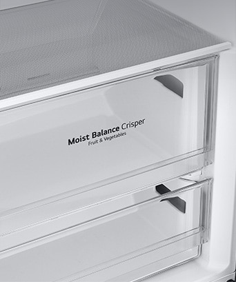The metallic decorations inside the fridge on the drawers are highlighted and labeled "Metallic Decoration" on the photo.