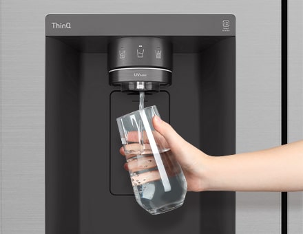 Filling glass with water from the refrigerator dispenser built into the door