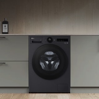 In the laundry room, a silver LG washing machine and dryer are placed side by side, with gray drawers positioned next to them.