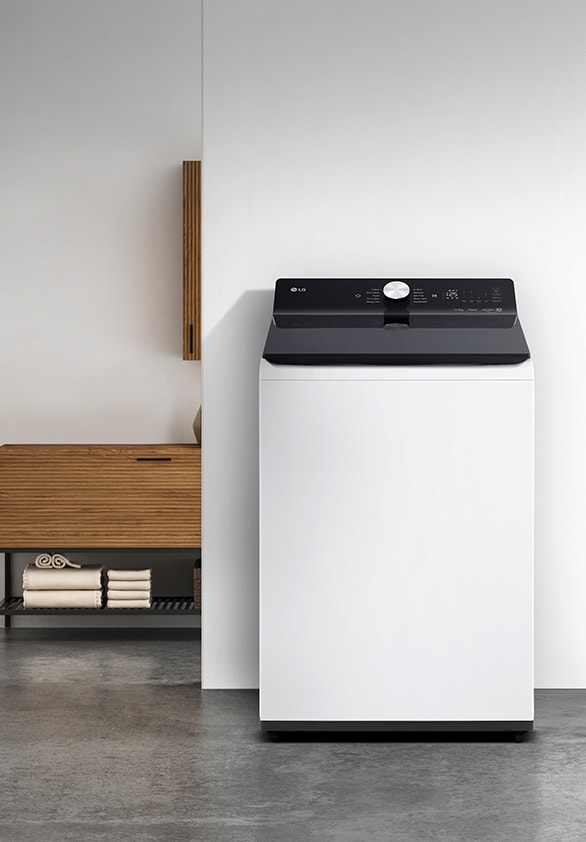 White LG top-load washing machine with sleek, modern design placed in a minimalist laundry spaceWhite LG top-load washing machine with sleek, modern design placed in a minimalist laundry space