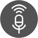 A woman sits in a window holding a drink. She speaks to the AI speaker show by a line from her to the speaker and a sound wave next to her face. The AI speaker then connects to the washer shown with a line and sound waves.	