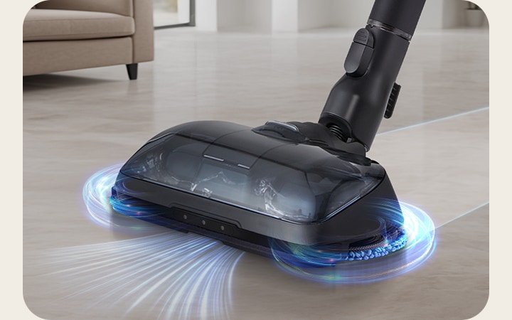 Power Drive Mop™ vacuuming and mopping simultaneously on wooden floor in living room.