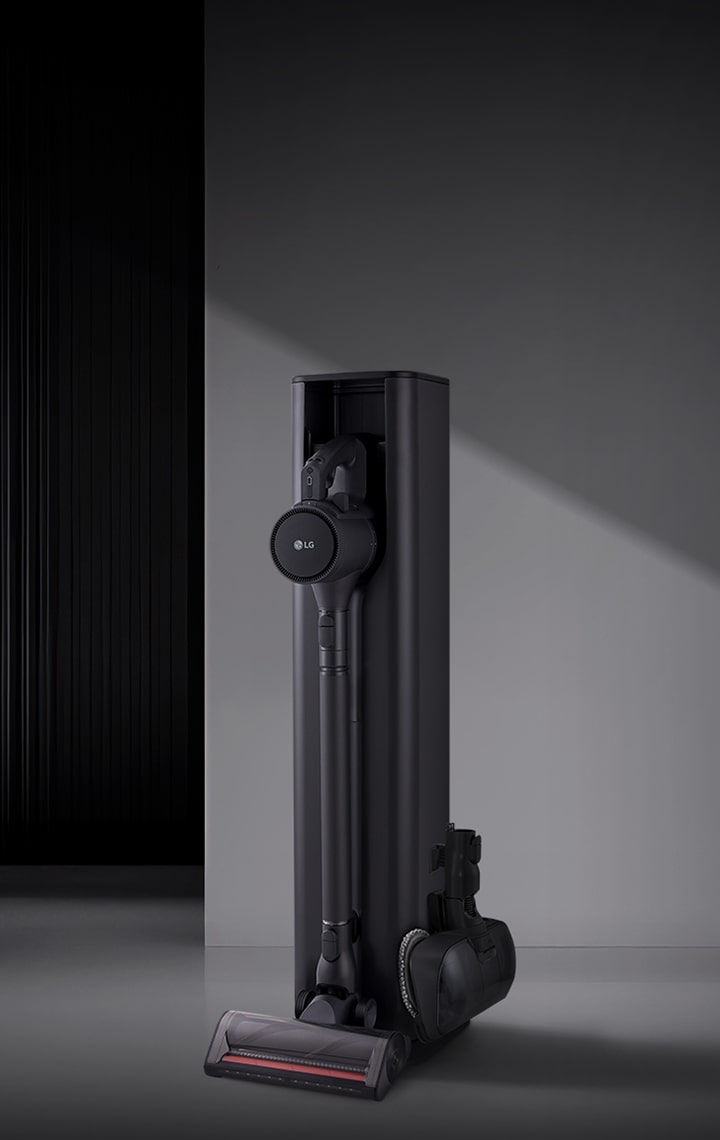 Tower vacuum in dark living space.