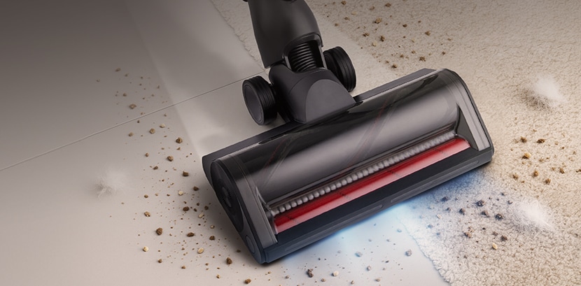 DUAL Floor Max™ Nozzle vacuuming dirt on a hard floor surface.