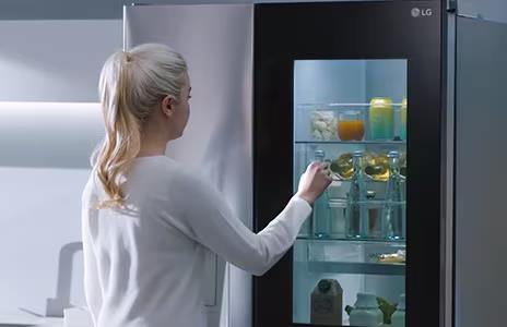 Image showing woman knocking on the InstaView fridge window