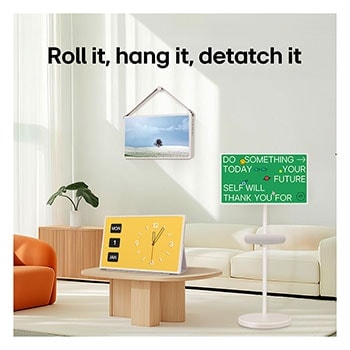 LG StanbyME 2 screens displayed in a modern living room. There is a StanbyME 2 on a stand, one is hung on the wall, and the other is propped up on a table using the folio cover.