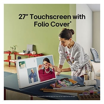 A person rolling their LG StanbyME 2 using the TV stand. The text explains how the Super Portable Screen has 4 hours of wireless playback and USB-C. 