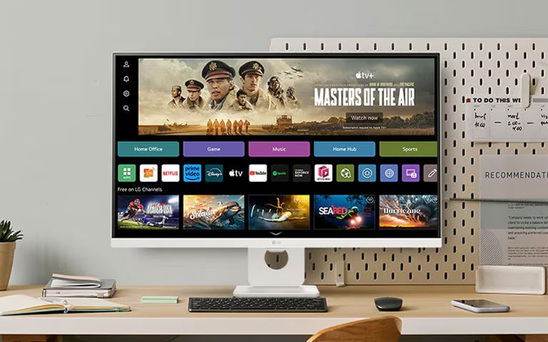 The video shows a smart monitor placed on the desk, with the screen transitioning in the order of webOS, home office, music, game, fitness, and sports.