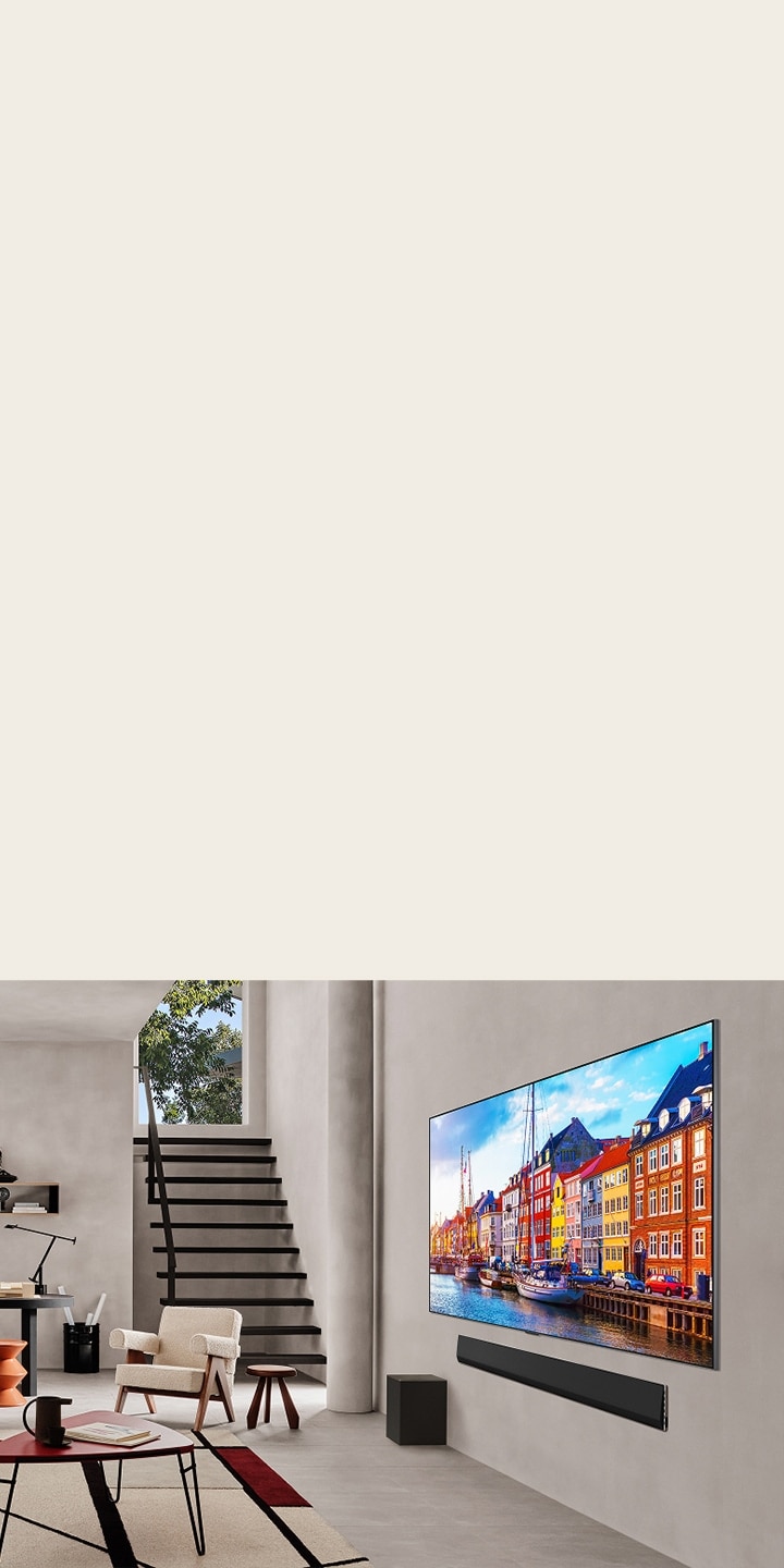 Sala de estar con una wall-mounted LG TV y una LG Soundbar.