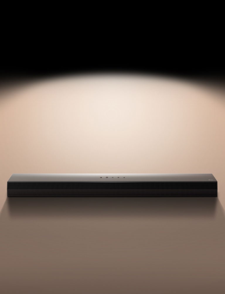 An image of the LG Soundbar against a black backdrop highlighted by a spotlight.