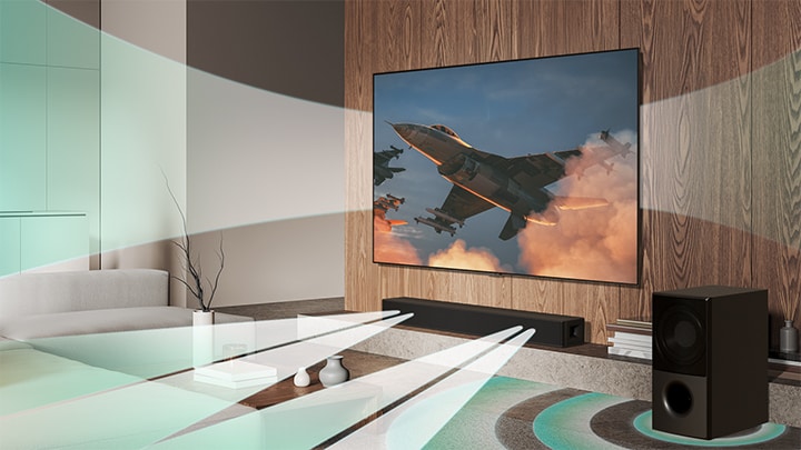 Se muestra un avión en una LG TV colgada en la pared y se escucha un efecto de sonido virtual que proviene simultáneamente de la LG TV, la LG Soundbar SH5A y su subwoofer, creando la WOW Orchestra.