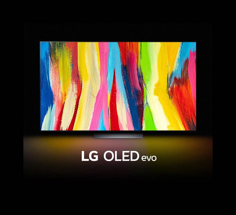 Un LG OLED C2 está en una habitación oscura con una colorida obra de arte abstracta de líneas verticales en la pantalla y las palabras "LG OLED evo" debajo.