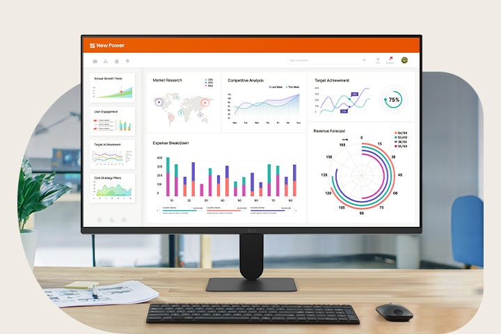 LG FHD Monitor on a desk displaying a business dashboard with charts and analytics, illustrating productivity and everyday office use.