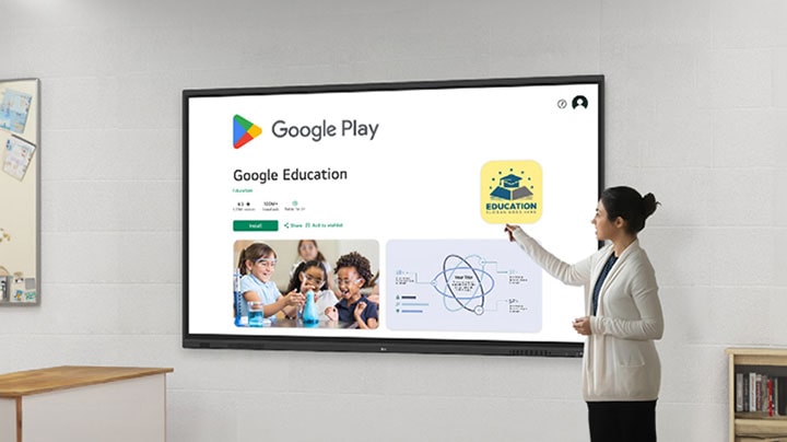 A woman is browsing the Google Play Store, downloading educational apps. This is possible as LG CreateBoard is a Google Certified interactive digital board.