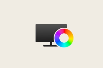 Ícono de un monitor de computadora con una superposición de paleta circular de colores, que representa la configuración de pantalla o color.