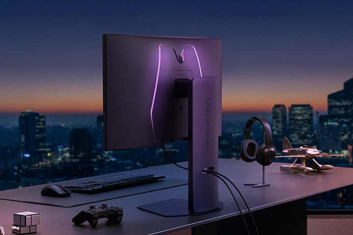 Rear view of a monitor with LED accents on a desk.