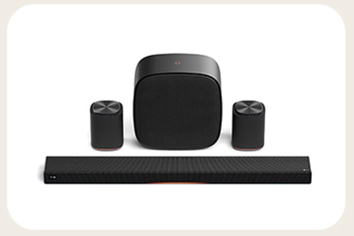 Home audio speaker set with a soundbar, center speaker, and two small speakers