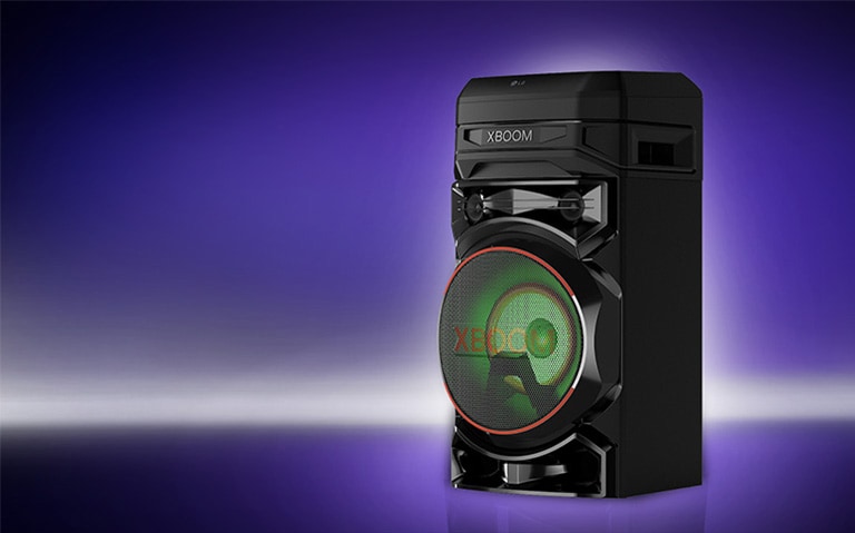 A low angle view of the right side of LG XBOOM against a purple background. The XBOOM lights are red.