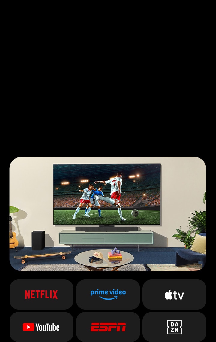 Two women watch a soccer game in a cozy living space. One woman holds a football and both cheer on their team with yellow and red loudspeakers. The following logos are shown below. Netflix, Amazon Prime Video, Apple TV, Youtube, ESPN, and DAZN.