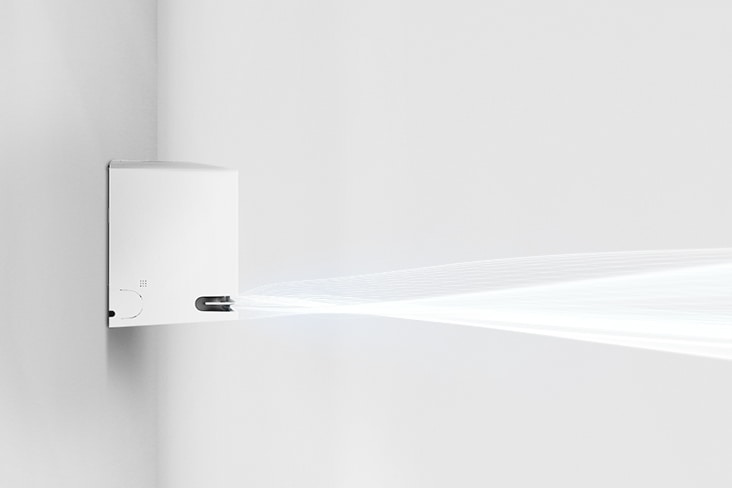 Side view of an LG air conditioner emitting a steady stream of airflow across a clean white wall.