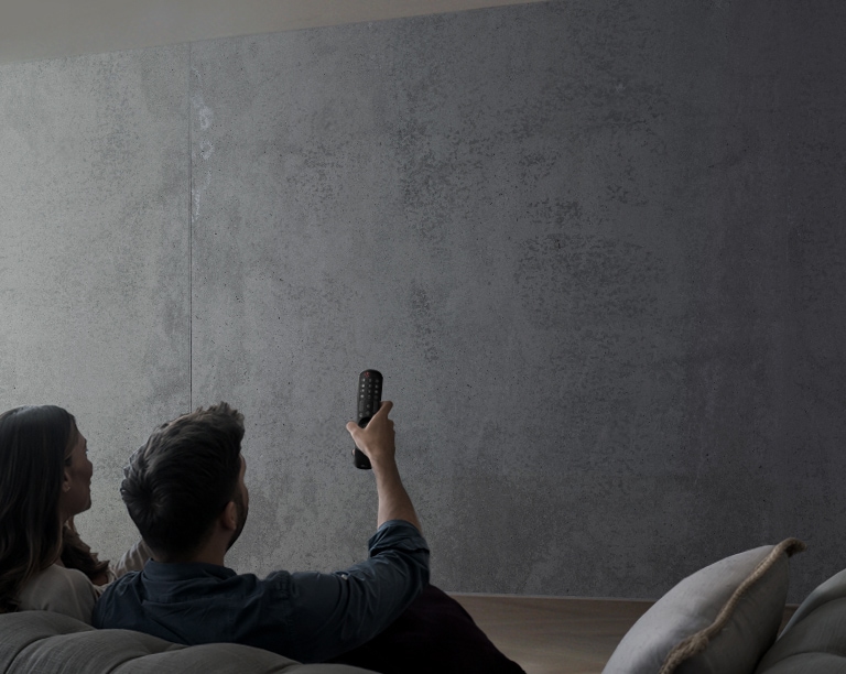 Image showing a couple watching a show using an LG UHD TV.