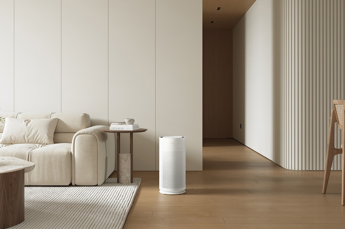 LG air purifier placed in a modern living room and minimalist furniture