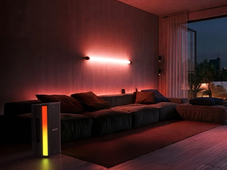 LG xboom Stage 501 speaker in a living room, using AI to sense the surrounding space and automatically adjust sound for optimal audio quality