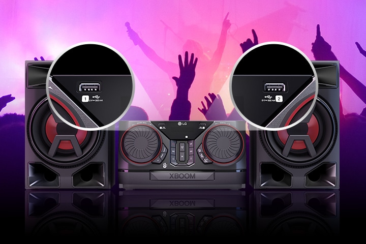 Front view of the LG XBOOM CK43N. The two USB ports are shown in circles closed-up. Behind the product, silhouettes of partygoers are visible.