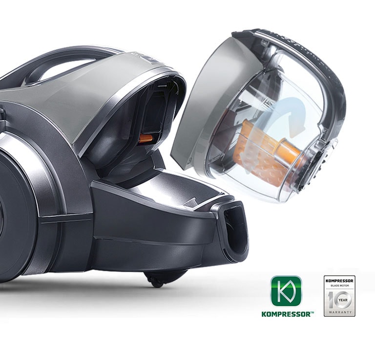 The Automatic Dust Kompressor™ is marked with double arrows on the bin to illustrate on the purpose of the handling of dust compaction in the bin while vacuuming.