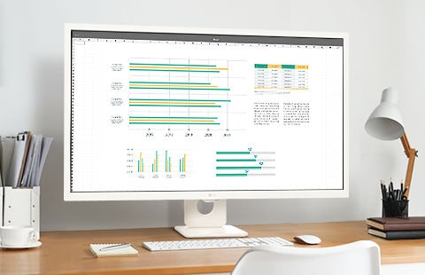 On the desk, there's a smart monitor, displaying a screen in use for home office purposes.