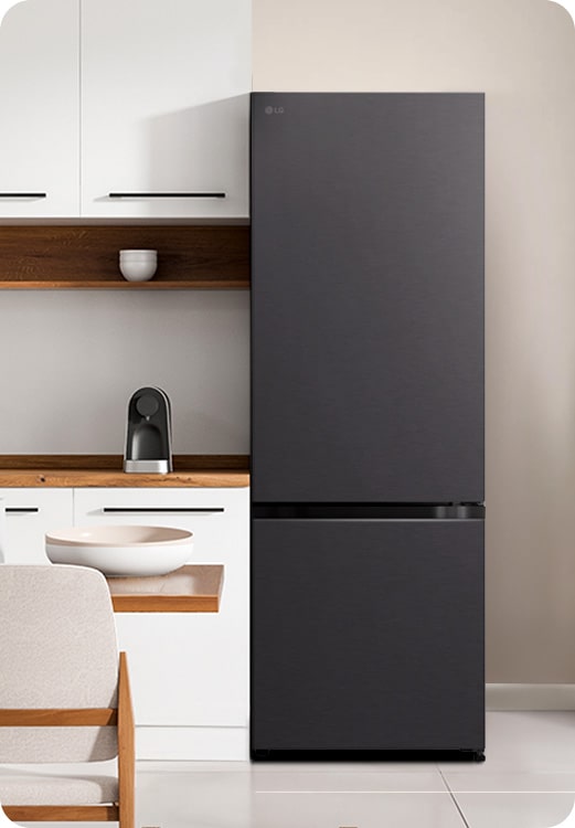 The front view of lg bottom freezer refrigerator with water dispenser in a white modern kitchen room.