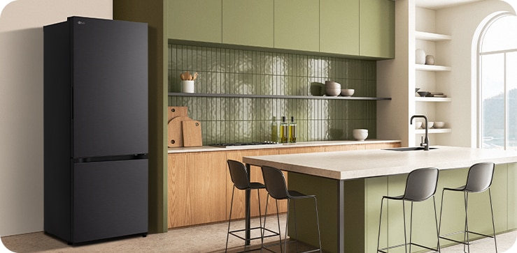 The side view of lg bottom freezer refrigerator with water dispenser with green cabinets and a stylish island.