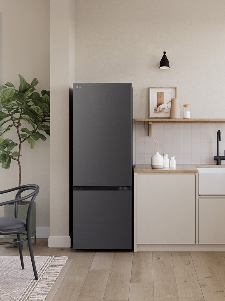 Overall view of the kitchen with lg bottom freezer refrigerator with water dispenser installed beside the countertop.