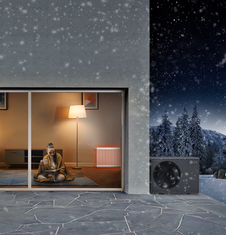 Kobieta relaksuje się z kubkiem i książką pod kocem; za nią po prawej stronie ciepły grzejnik, a na zewnątrz LG Therma V.