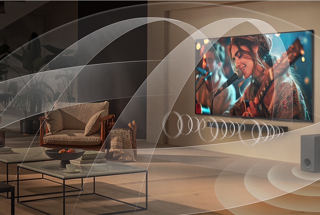 Telewizor i soundbar LG emitujące dźwięk na scenie koncertowej ilustrują połączony dźwięk WOW Orchestra.