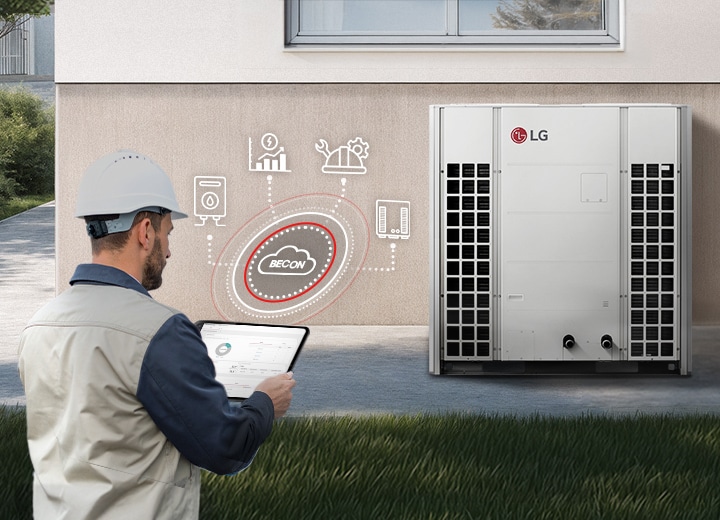 Instalator trzyma tablet sterujący komercyjną pompą ciepła Therma V R32 Monobloc 51 kW poprzez system BECON Cloud.